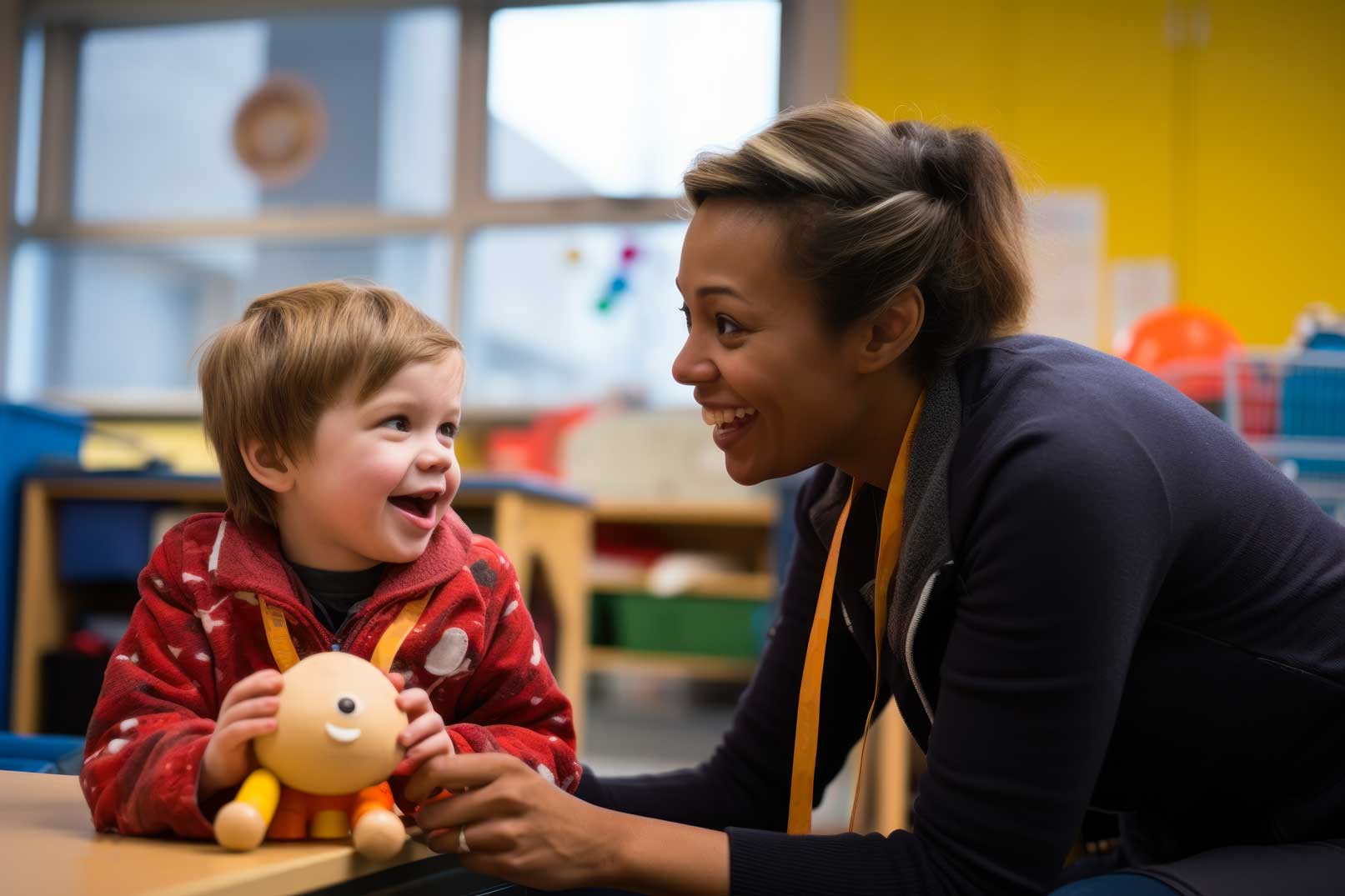 A speech therapist at an inclusive center works with a child with autism.