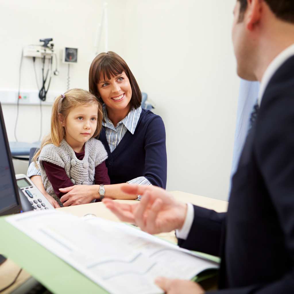 Clinician explaining treatment options for autism to a mom