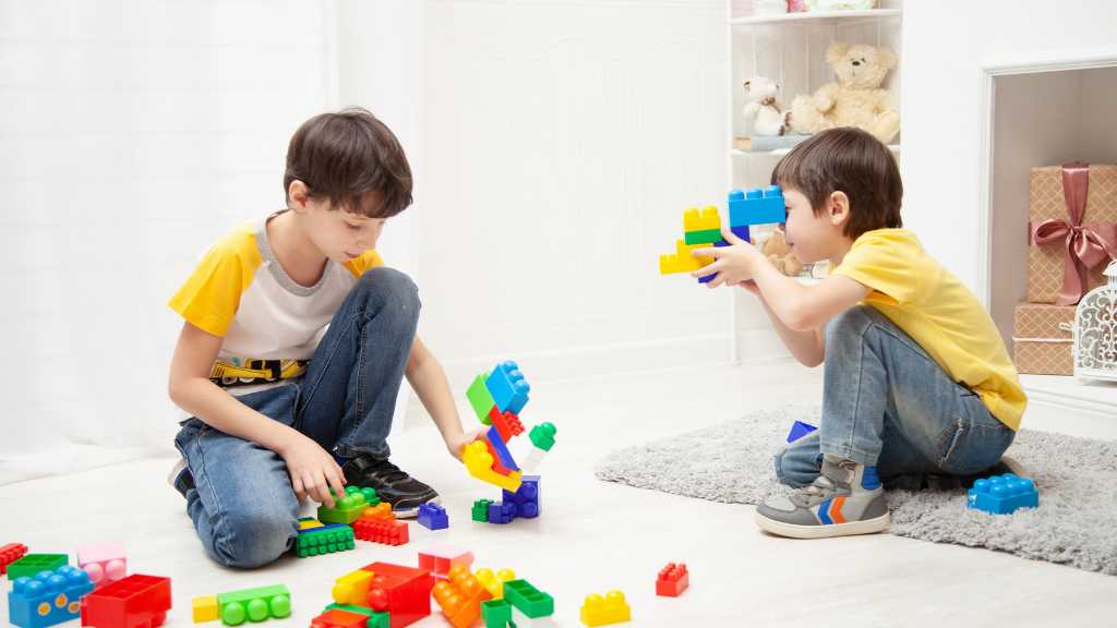World Autism Awareness Day children playing with blocks promoting inclusion and autism acceptance