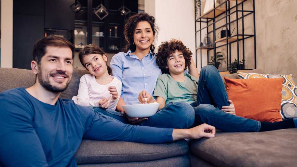 Family watching TV showing neurodivergent characters in media and inclusive storytelling